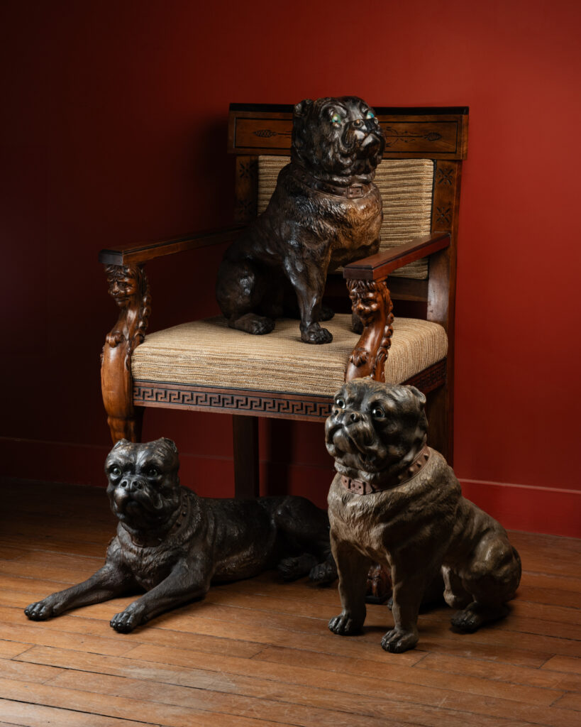 A Group of Three Painted Terracotta Pugs with Sulphide Eyes