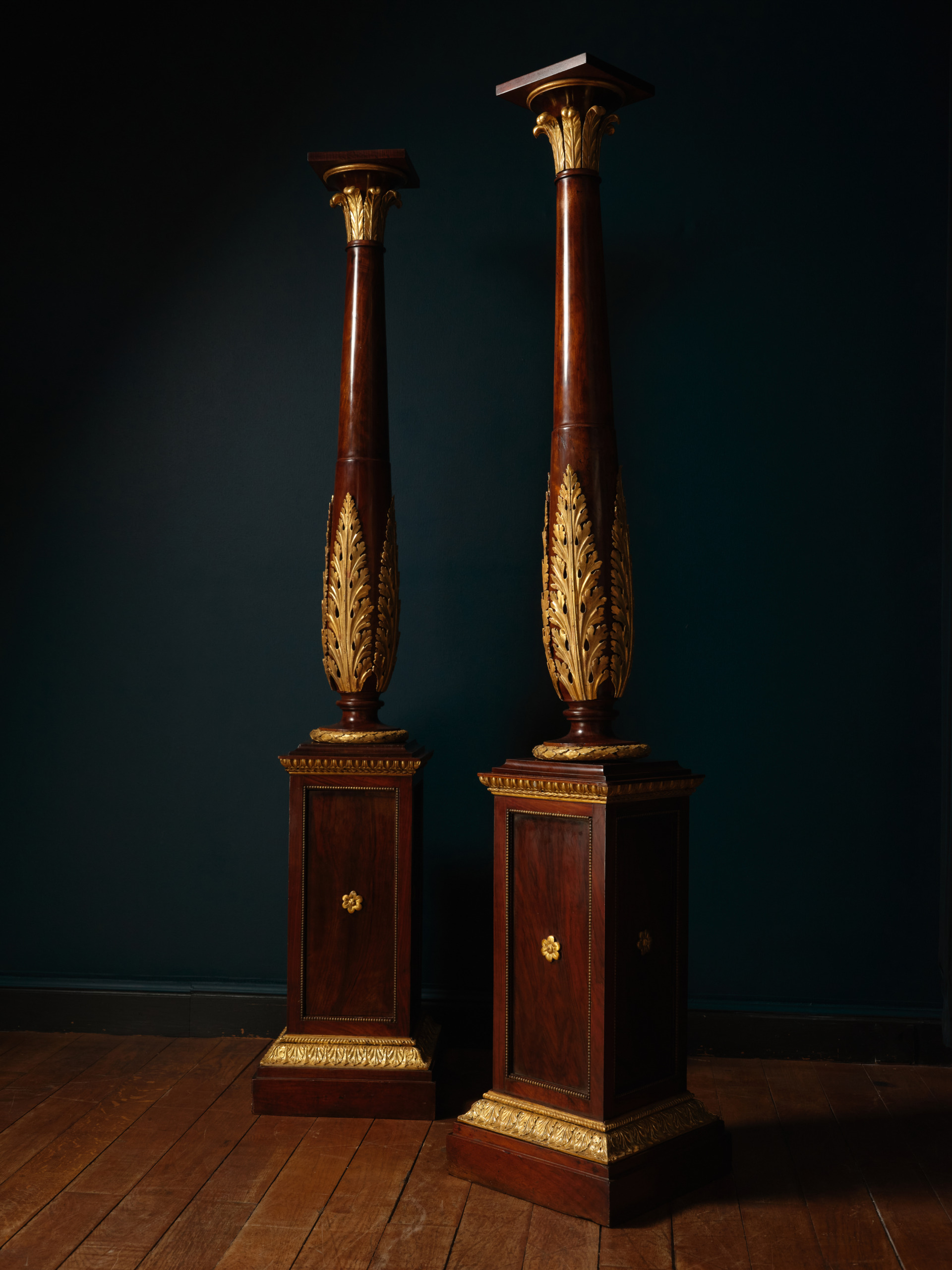 A Pair of Mahogany and Giltwood Torchères