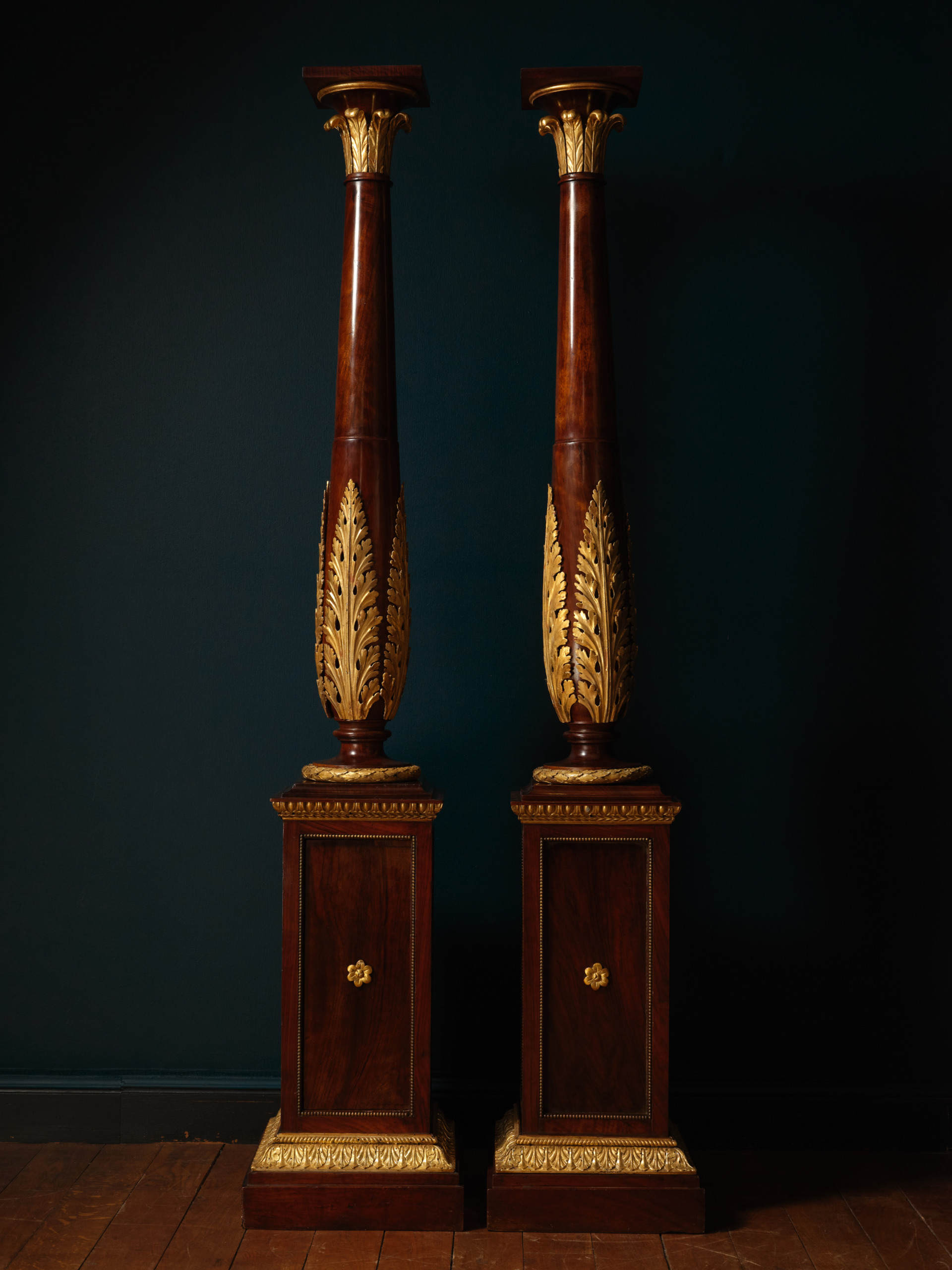 A Pair of Mahogany and Giltwood Torchères