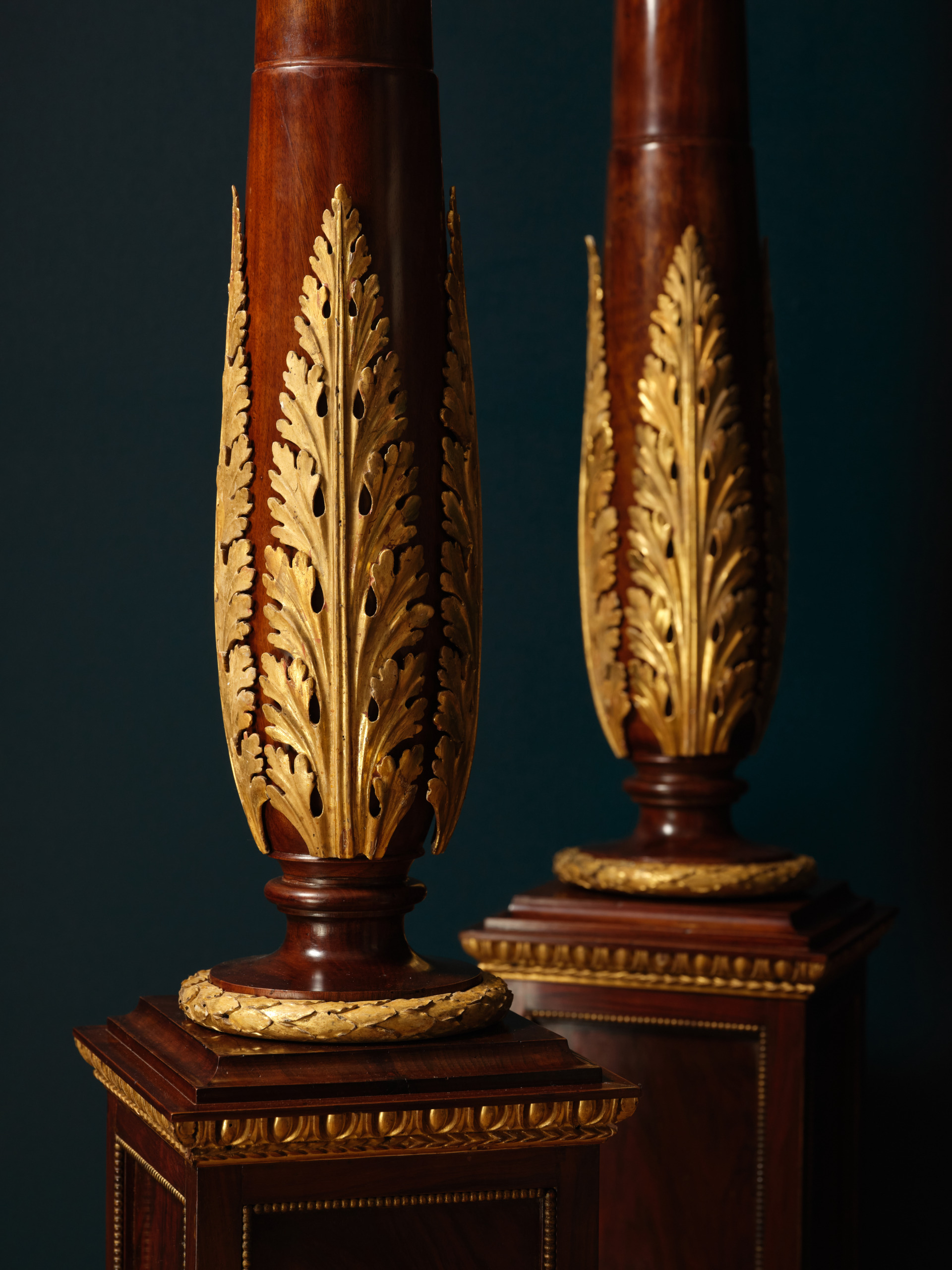 A Pair of Mahogany and Giltwood Torchères