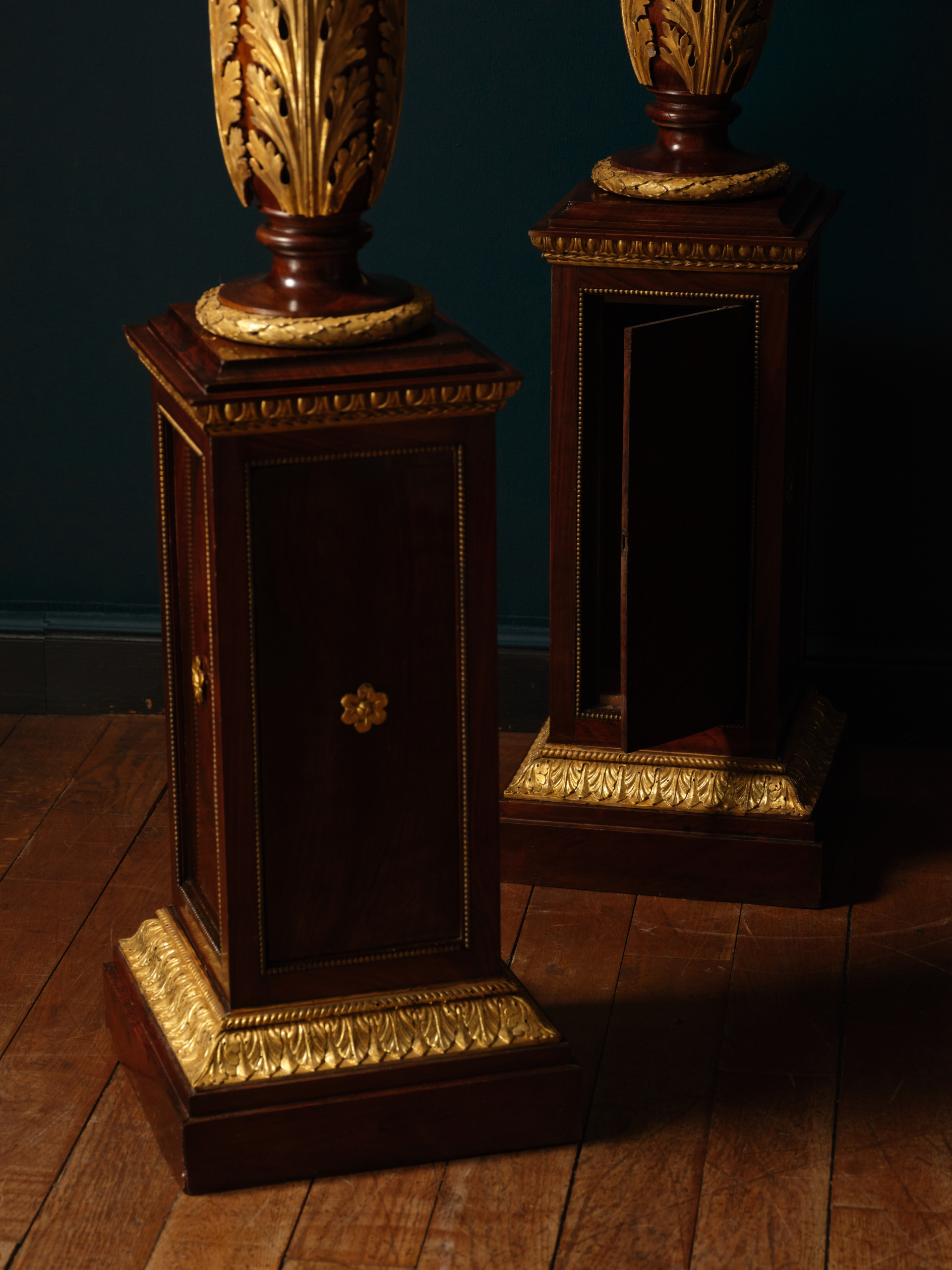 A Pair of Mahogany and Giltwood Torchères