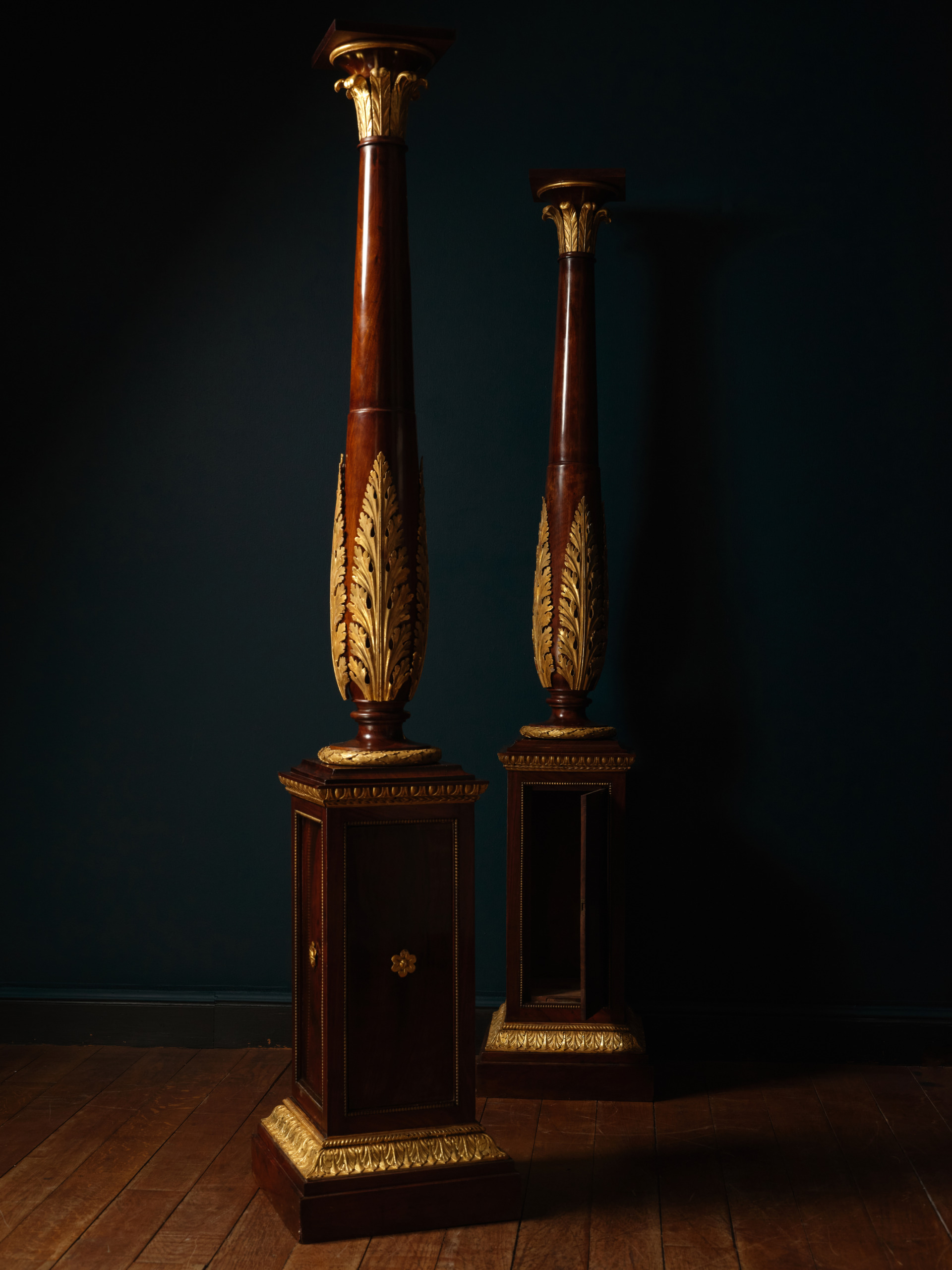 A Pair of Mahogany and Giltwood Torchères