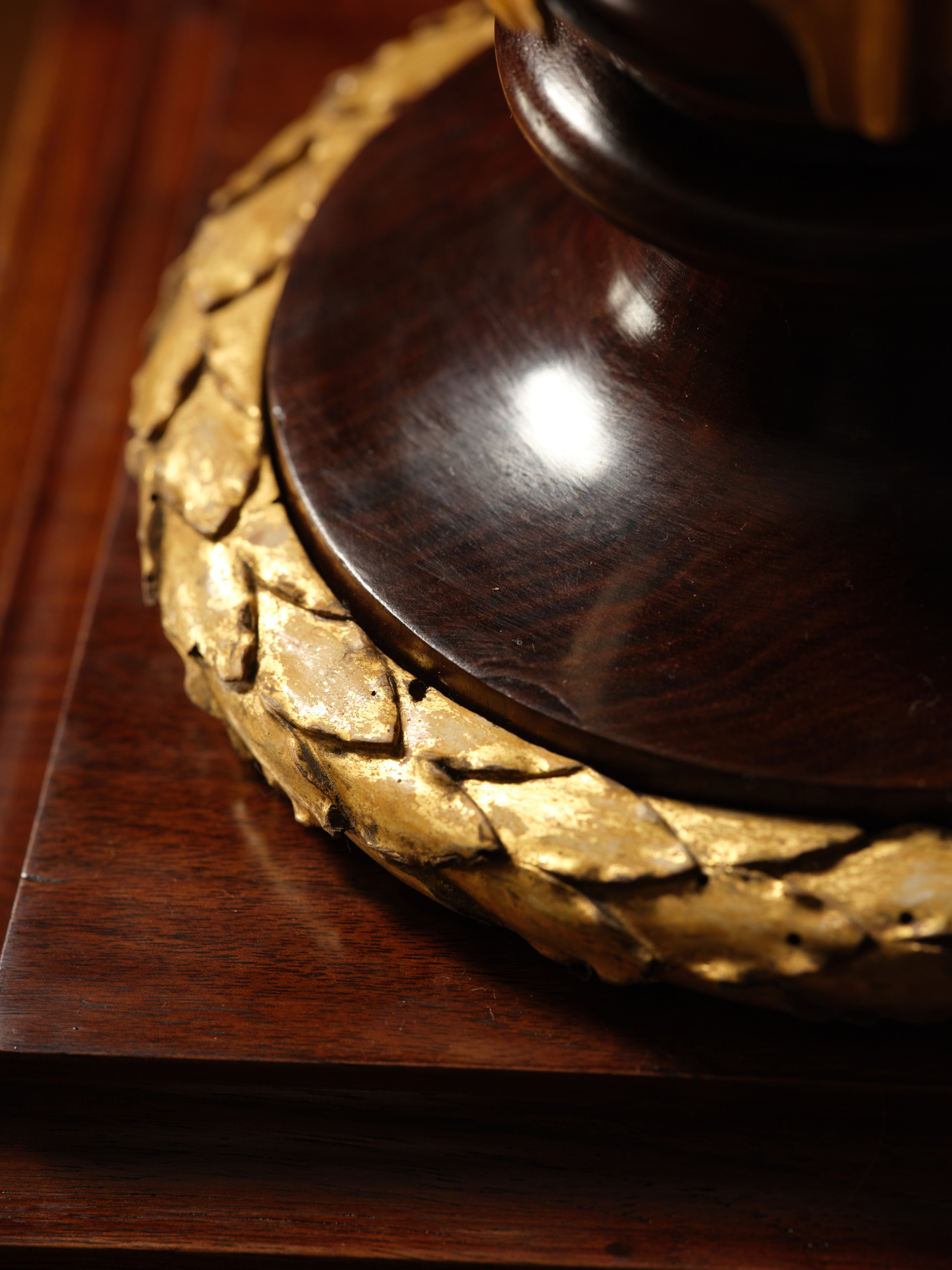 A Pair of Mahogany and Giltwood Torchères