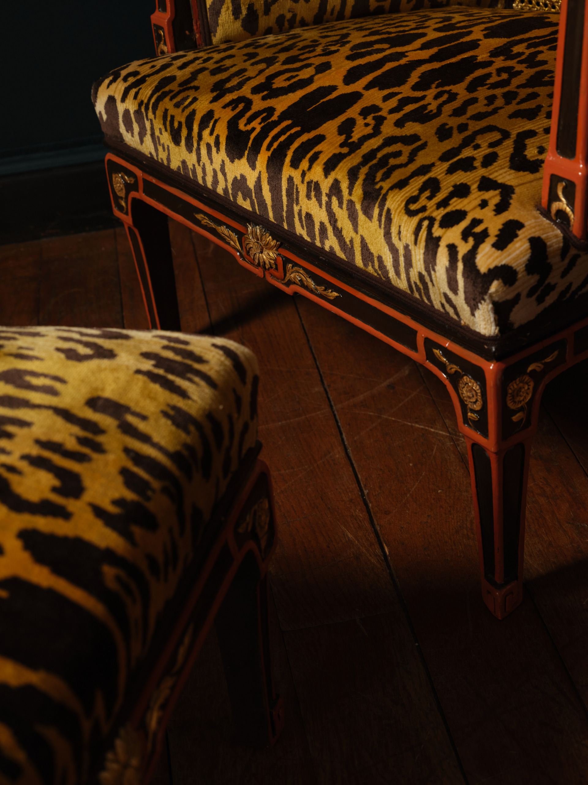 An Italian Brown and Orange Lacquered and Parcel-Gilt ‘Chinoiserie’ Bergère and Stool, ca. 1900